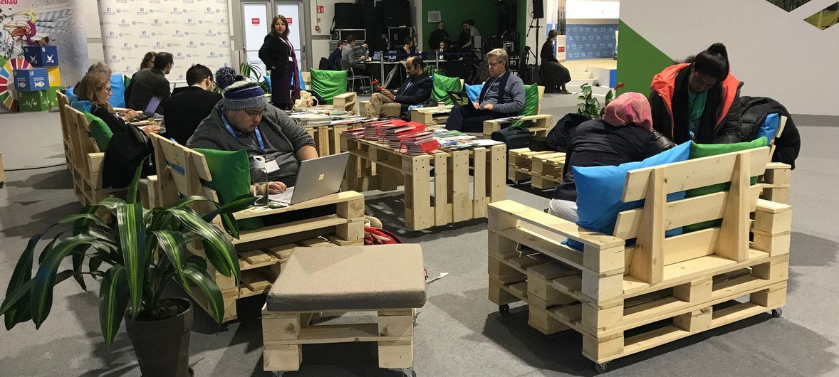Furniture made from repurposed wooden pallets provides a comfortable break for delegates at the COP24 climate change conference in Poland.