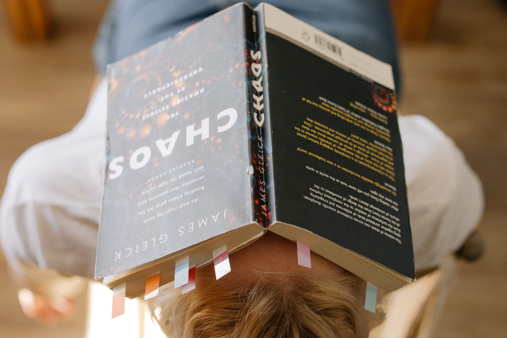 Boy with Chaos book over his face